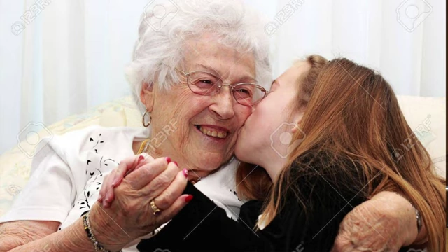 A child showing affection to an elderly woman, symbolizing small acts of love and kindness as spiritual fruit.