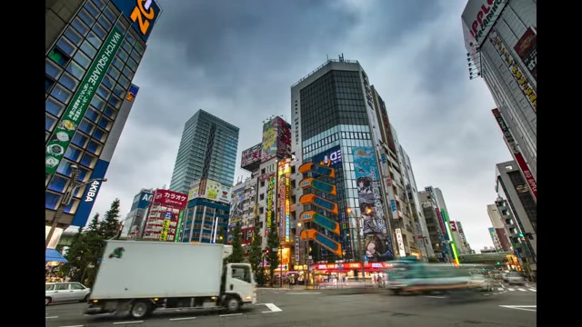 A bustling city street with modern buildings