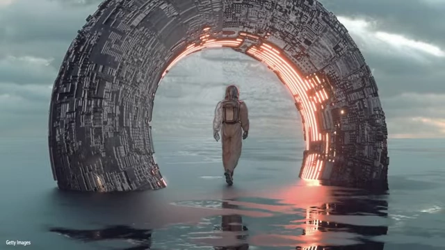 An astronaut-like figure walking towards a futuristic gateway on a watery landscape