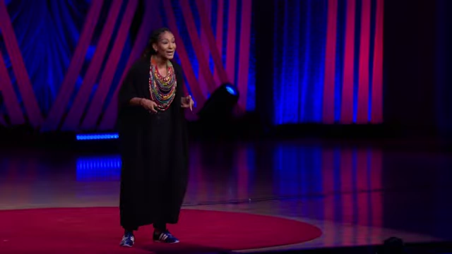 Ruha Benjamin on stage, defining 'ustopias' as 'what we create together when we're wide awake'