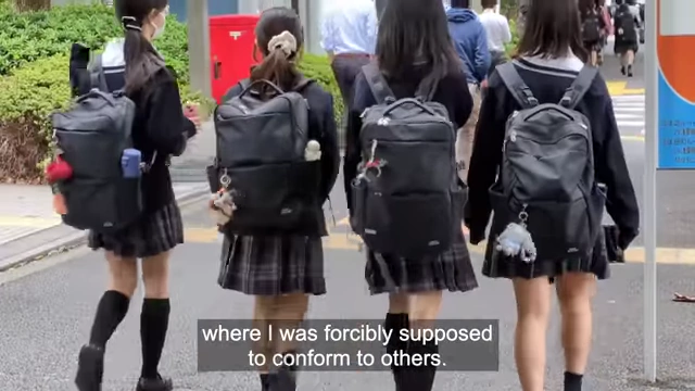 Japanese schoolgirls, representing the environment where bullying and pressure to conform can lead to hikikomori.
