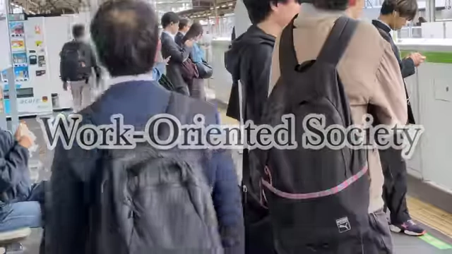 A collage of images on screen illustrates Japan as a "Work-Oriented Society," showing commuters and people working.