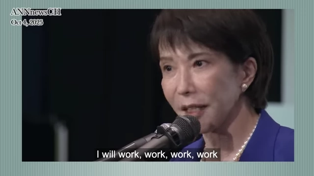 A news report shows a female politician stating, "I will work, work, work, work," symbolizing the intense work ethic promoted in Japan.