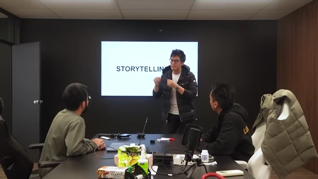 The speaker teaching a small group in a workshop setting, emphasizing the importance of meaning in storytelling.
