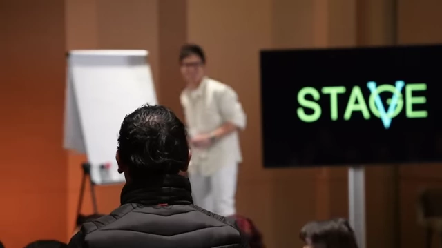 An audience watching a Q&A session during a workshop.