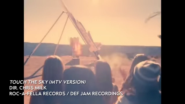 Chris Milk's Touch the Sky music video still with a rocket launch