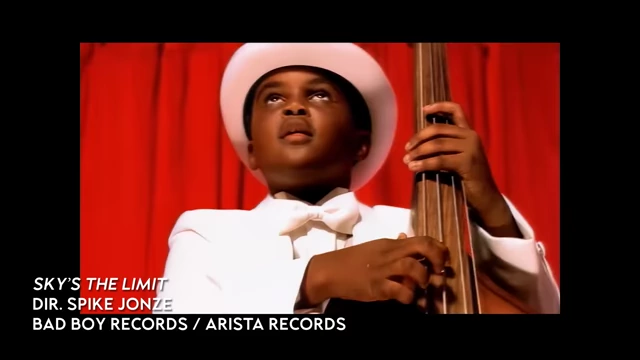 Spike Jonze's Sky's the Limit music video still with a child playing bass