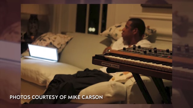 Jay-Z working on a laptop in a studio setting