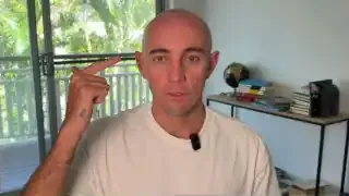 Man pointing to his head, indicating the mind and imagination.