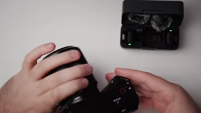 The DJI Mic Mini receiver connected to a camera.