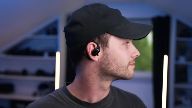 The reviewer wearing the HollyLand Lark MAX 2 wireless monitoring headphones.