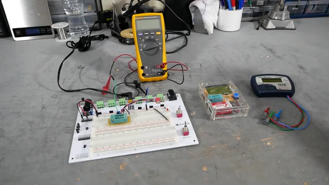 Overview of the three germanium transistor testers: a DIY breadboard circuit, a compact M-tester, and a professional Peak Atlas DCA75.