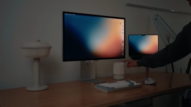 Desk setup with two custom lamps, showing one being tapped to control room lighting