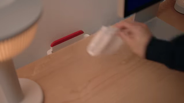 Magnetic under-desk trash bin with integrated brush