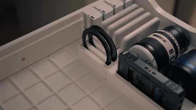 An Alex drawer organized with various Gridfinity bins holding camera lenses and accessories
