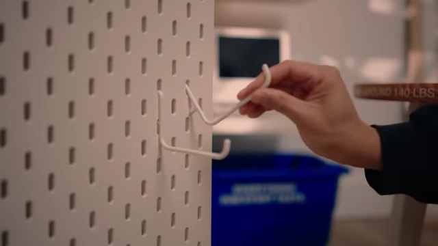 Hidden SKADIS pegboard for accessible storage