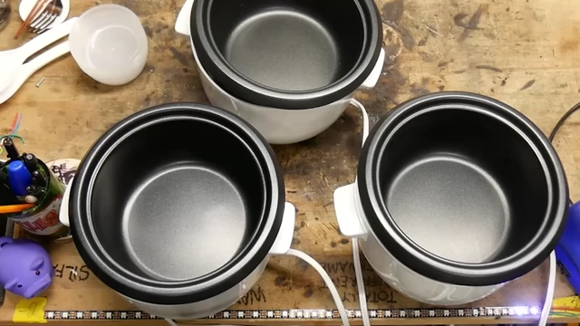 Three small Aroma rice cookers for batch experiments.