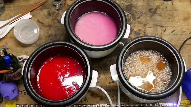 Rice cookers filled with Faygo Red Pop, Gamer Supps, and Yuengling beer mixtures.