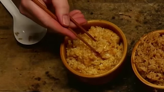 Close-up of the orange cooked Walmart hot sauce rice.