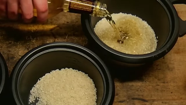 Pouring Malort into a rice cooker with rice.