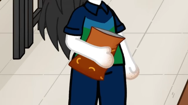 A close-up of Claudia's hand shows remnants of cheese puff dust.