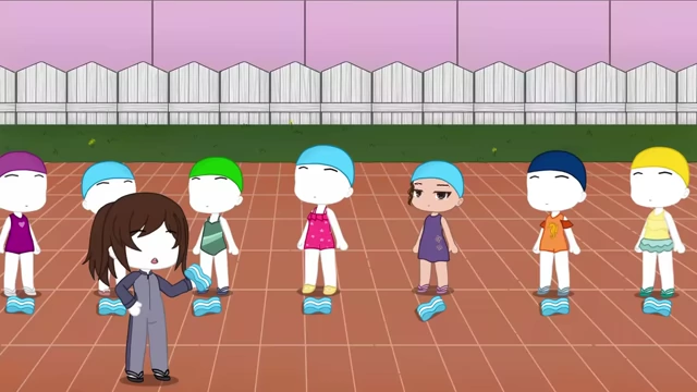 A swimming instructor stands with several students ready for their lesson.