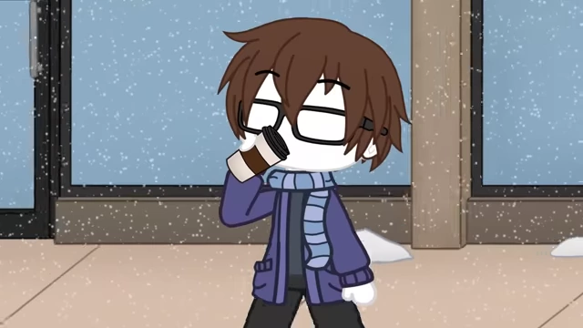 A person wearing a scarf drinks hot cocoa in winter, with their glasses beginning to fog up.