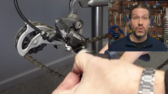 The speaker as a bicycle mechanic, a representation of hands-on, physical work.