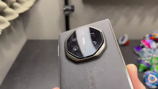 A close-up view of the distinctive circular rear camera module on the Huawei Mate XT.