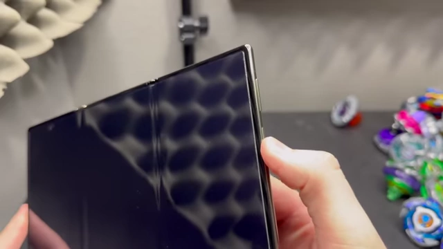 A partial fingerprint being used on the Huawei Mate XT's side scanner.