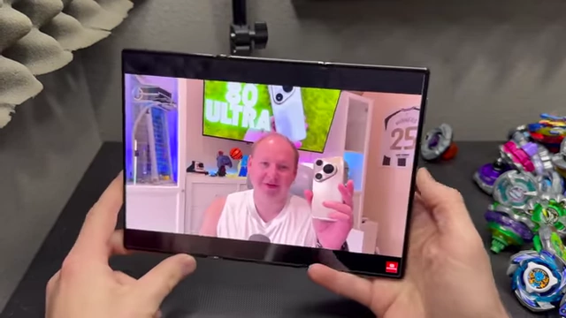 A video playing on the Huawei Mate XT screen before a notification or volume pop-up appears.