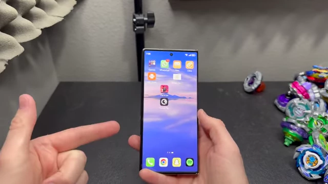 The Huawei Mate XT in its folded phone mode, displaying the home screen and illustrating the 90Hz refresh rate.