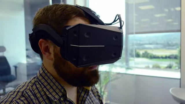 A man is shown wearing a virtual reality headset, illustrating the physical appearance of users.