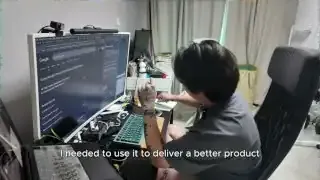 The speaker focused on a large computer screen