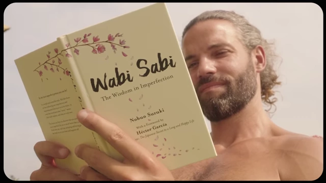 A book titled "Wabi Sabi: The Wisdom in Imperfection" is shown being read.