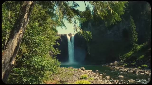 A powerful waterfall in a lush green forest, visually representing the "flow state" in creativity.