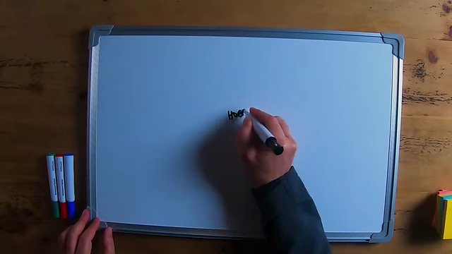 The speaker drawing a circle for "Hobby" at the center of a whiteboard, illustrating the starting point of a mind map.