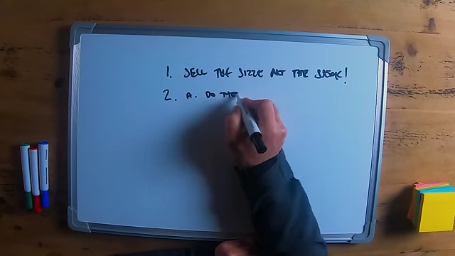 The speaker writing "do they need you?" on a whiteboard as the first step in selling.