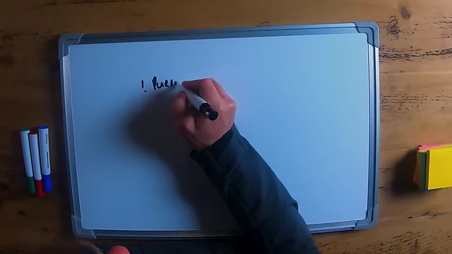 The speaker writing "purpose" as the first key point for hiring.