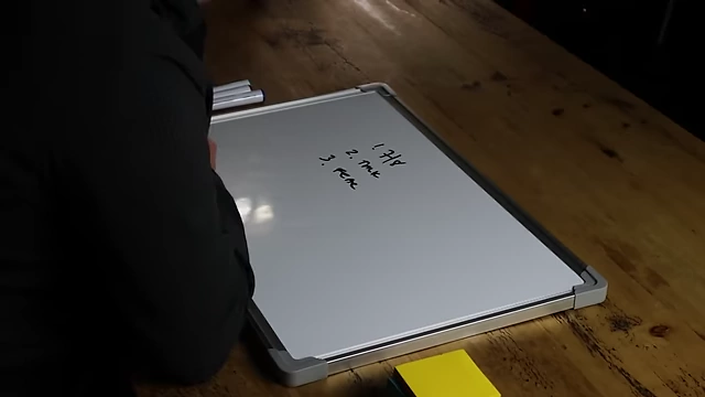 The speaker writing "no fear" to overcome hesitation when firing someone.
