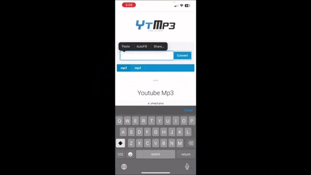 A phone screen showing the YTMP3 website, used for converting YouTube videos to MP3 audio files.