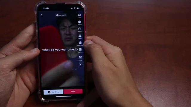 A phone screen showing a TikTok video with captions positioned to avoid being covered by UI elements.