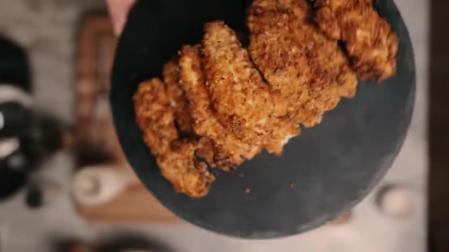 A close-up view of the crispy, golden-brown air-fried chicken tenders