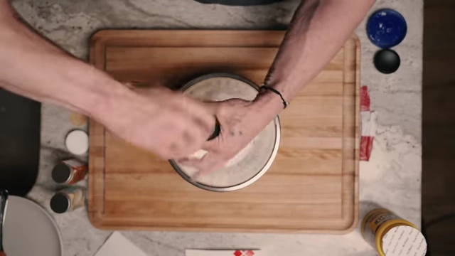 Grinding black pepper into the dry coating mix