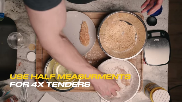 Breading multiple chicken tenders, with a caption indicating measurements for four tenders