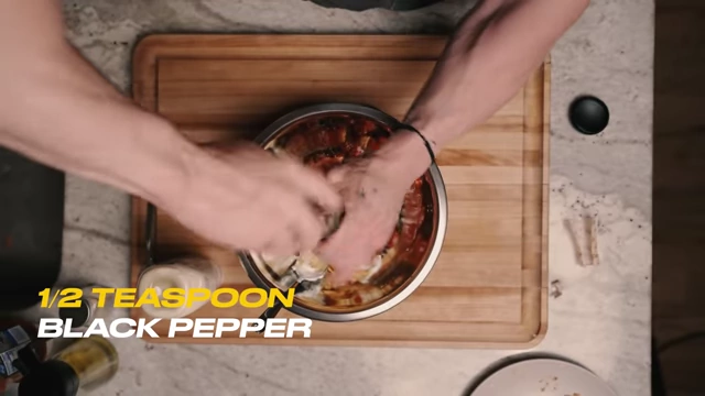 Grinding black pepper into the sauce mixture