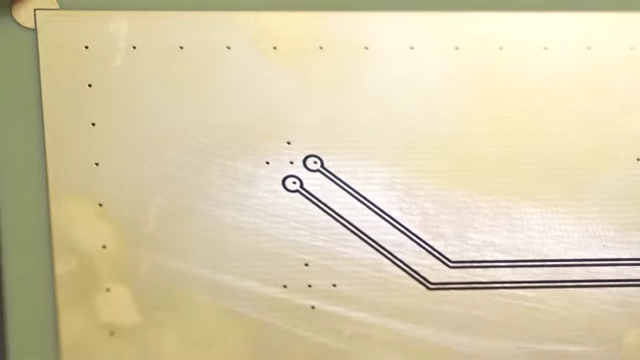 Laser-etched traces connecting to pre-baked vias on a VIA Grid PCB