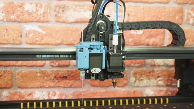 Solder paste being applied by a paste extruder on the pick-and-place machine