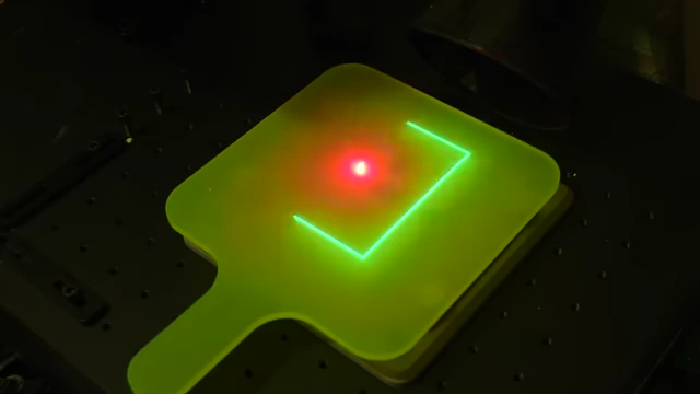 Laser light outlining the PCB area on a test paddle, showing how the laser becomes visible on FR4