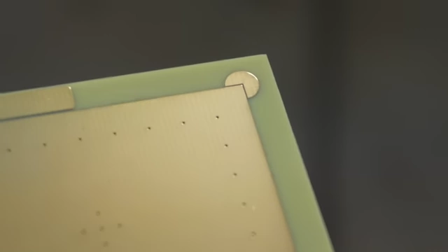 Close-up of the "Pac-Man" alignment features in the corner of a VIA Grid PCB